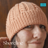 Handknit cable beanie in soft salmon pink wool from Shoreline styled for cosy winter wear - Parade Handmade