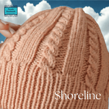 Close-up of cable stitch detail on Aran-style salmon beanie with turn-up edge from Shoreline - Parade Handmade