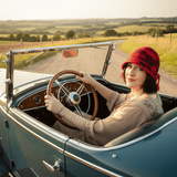 Woman driving a roadster car and wearing a Red Cloche Hat, Black Detail, Red Satin Plait, 57/58cm, By Parade. - Parade Handmade