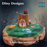 Fairy house tree stump with a little flower and ladybird on top all on a felted garden circle on a slice of log by 'Ditsy Designs' at Parade-Handmade