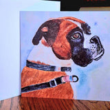 Artistic watercolour illustration on a card of a boxer dog with a collar on a wooden table by Nuala Brett-King - Parade Handmade