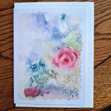 Greeting card by Nuala Brett-King with a misty watercolour design of pink roses on a wooden background - Parade Handmade