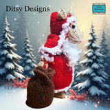 Side view of Santa Claus Mouse hand knitted in a  By Ditsy Designs seen here in snowy weather Parade Handmade Ireland