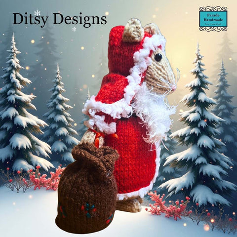 Side view of Santa Claus Mouse hand knitted in a  By Ditsy Designs seen here in snowy weather Parade Handmade Ireland