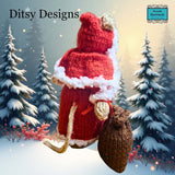 Back view of Santa Claus Mouse hand knitted in a  By Ditsy Designs seen here in snowy weather Parade-Handmade. Ireland
