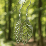 Silver Leaf metal earrings on Sterling Silver Hooks with a forrst background - Lapanda Designs at Parade Handmade