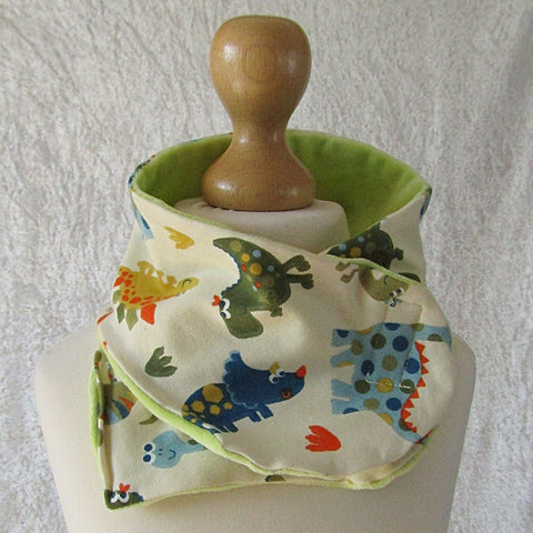 Cream Kids Scarf With Multi-coloured Dinosaurs, By JaDa Crafts Ireland - Parade Handmade