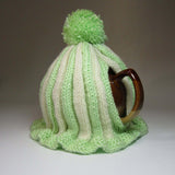 Super cute pastel green and cream striped Tea Cosy with bobble by Shoreline - Parade Handmade